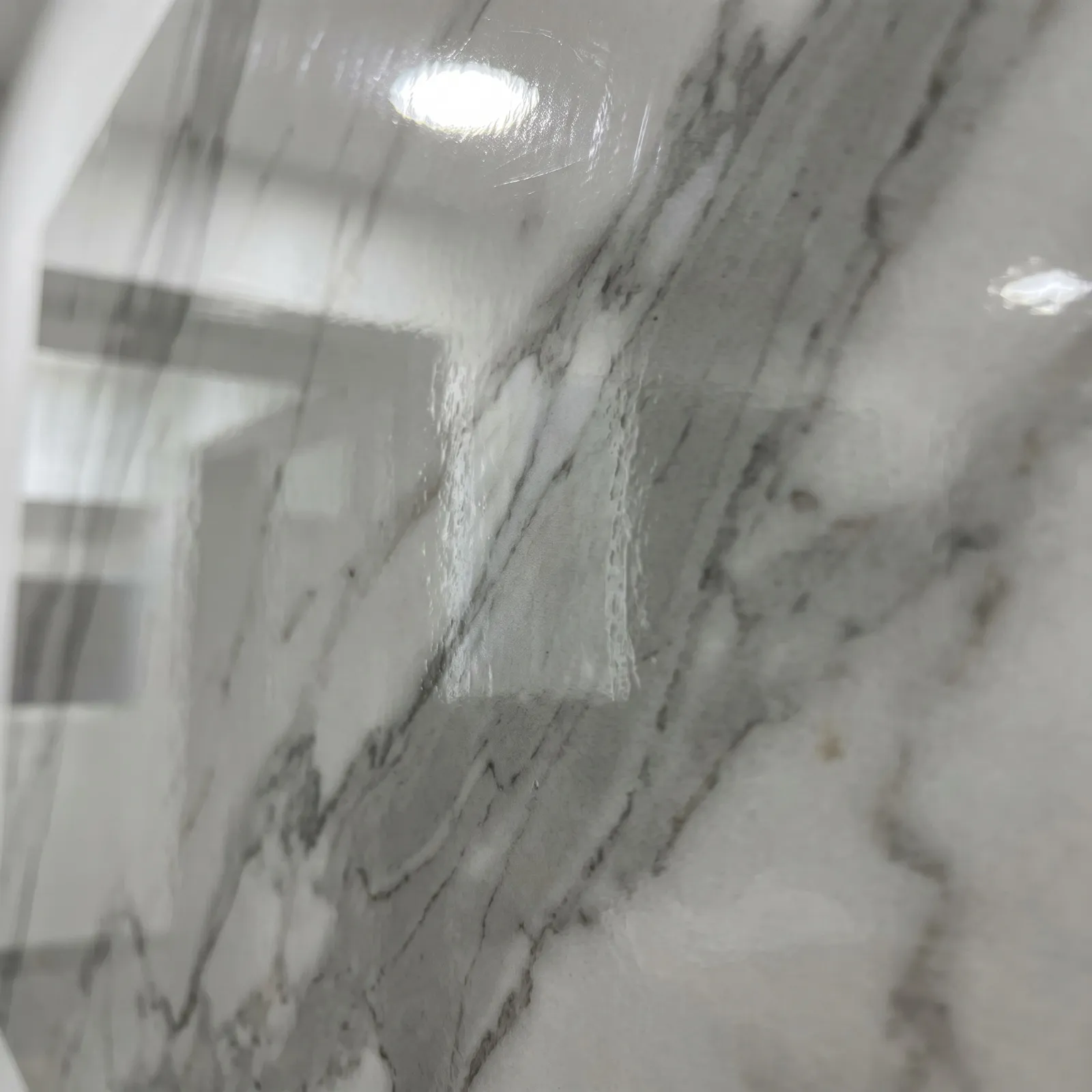 UV high-gloss marble wall panel close-up